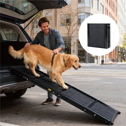 Man helping a dog use a pet ramp to get into a car on a city street.